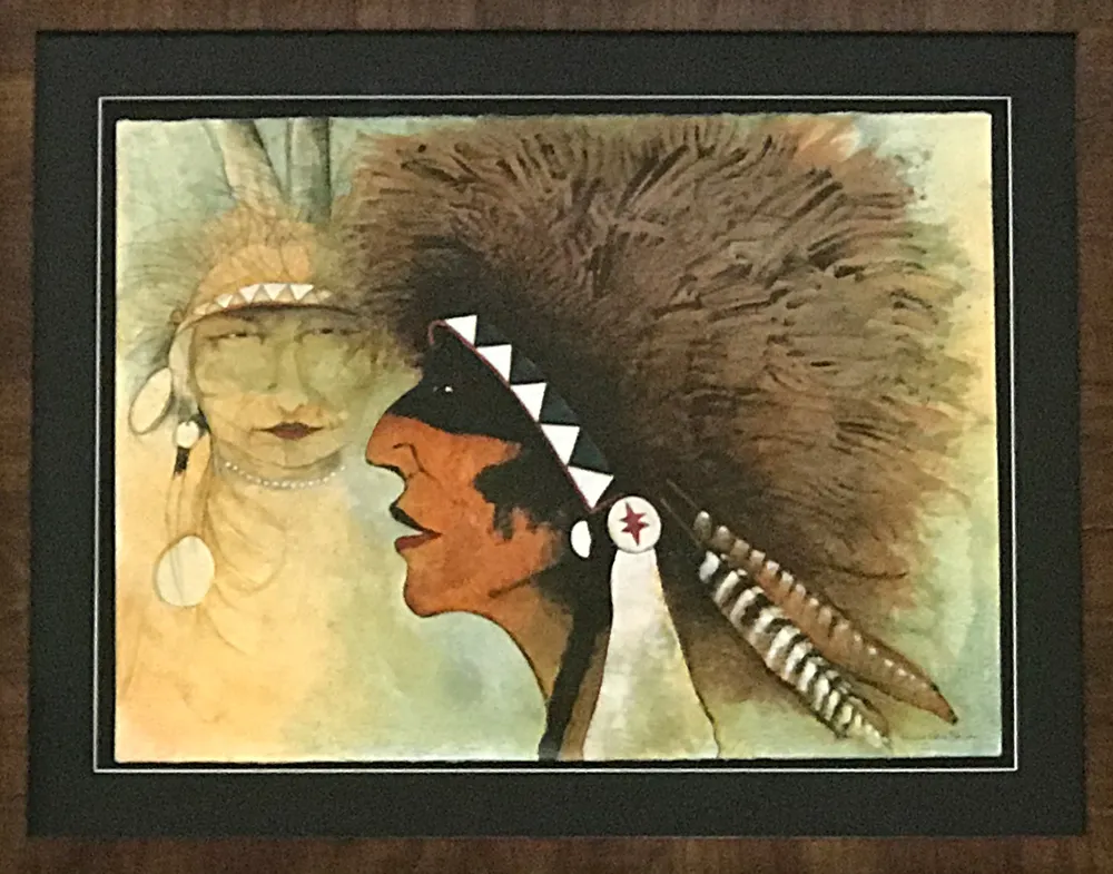 Profile of man in feathered headdress