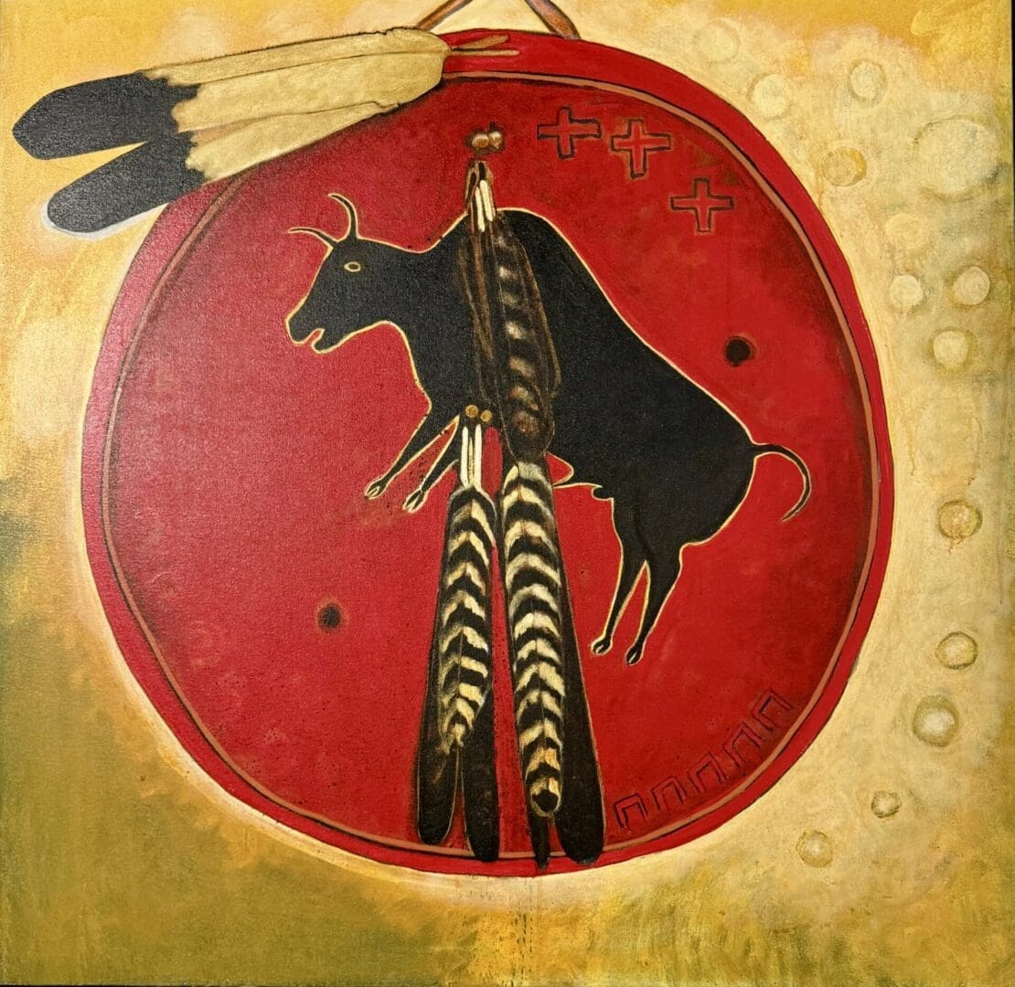 Native American-style painting of a black bull on a red circular shield with feathers.