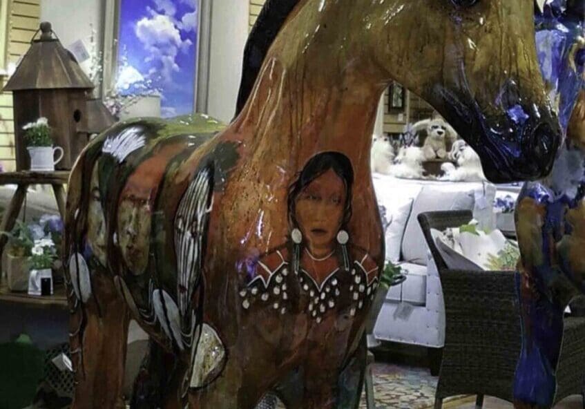 Colorful horse art display indoors
